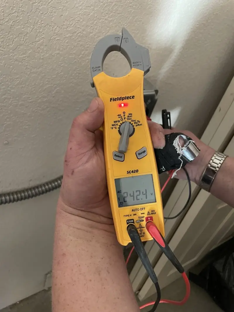 Voltage testing with clamp meter during Ceiling Fan Installation in Country Club